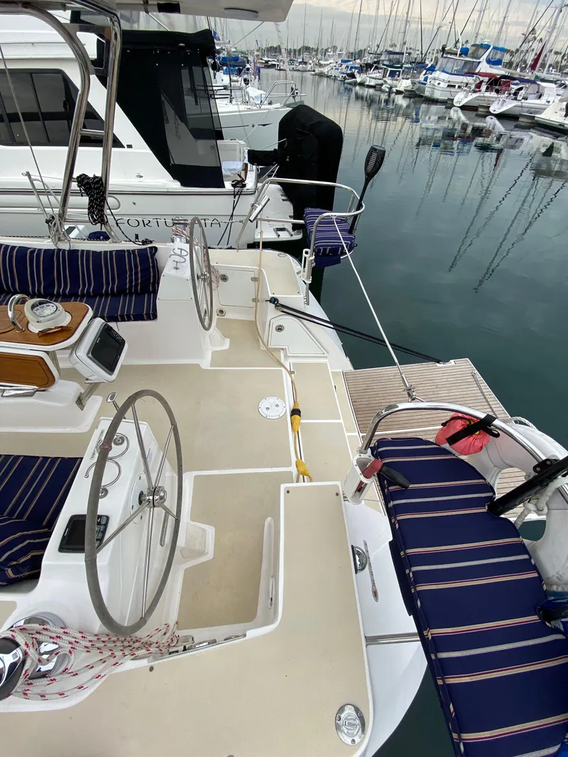 Slide: The Image of 2014 Marlow Hunter 40 sailboat with striped seating at marina. - 31