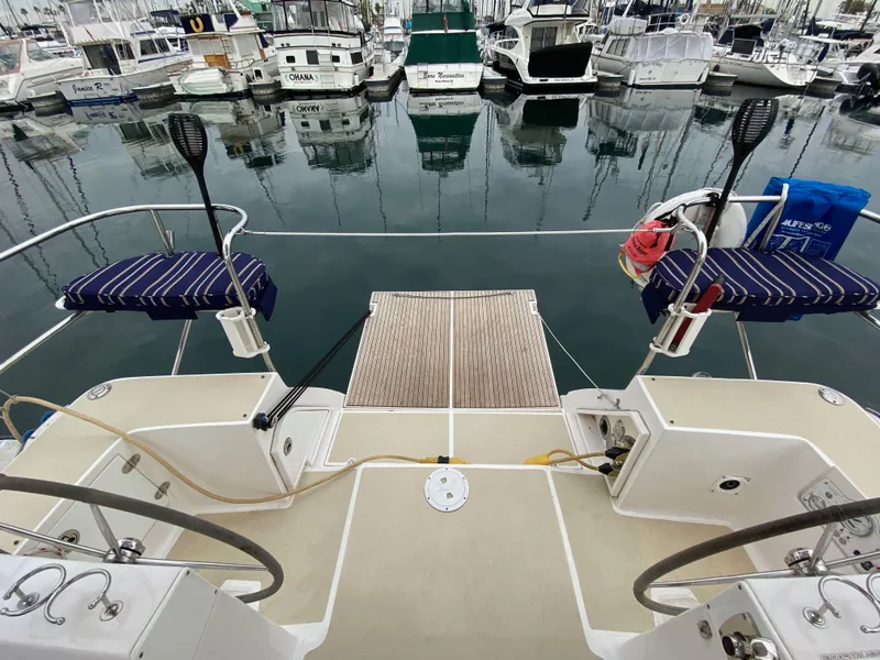 Slide: The Image of 2014 Marlow Hunter 40 yacht docked at marina, featuring spacious deck and seating. - 32