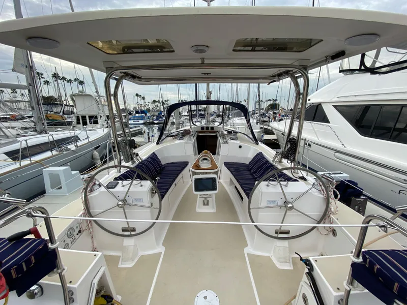 Slide: The Image of 2014 Marlow Hunter 40 sailboat cockpit with dual steering wheels in marina. - 34
