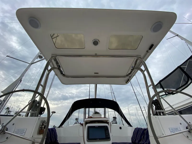 Slide: The Image of 2014 Marlow Hunter 40 sailboat cockpit with dual steering wheels and canopy. - 35