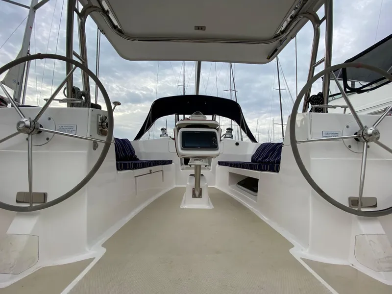 Slide: The Image of 2014 Marlow-Hunter 40 sailboat cockpit with dual steering wheels and navigation equipment. - 36