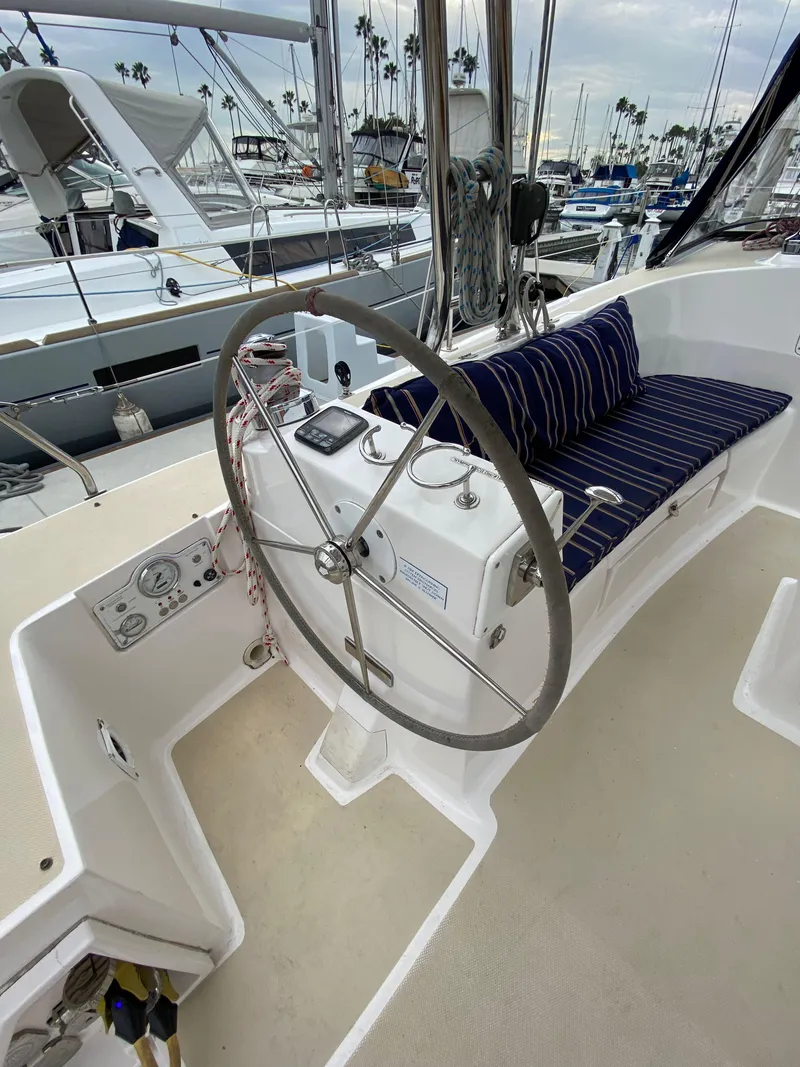 Slide: The Image of 2014 Marlow Hunter 40 sailboat cockpit with steering wheel and striped seating. - 37