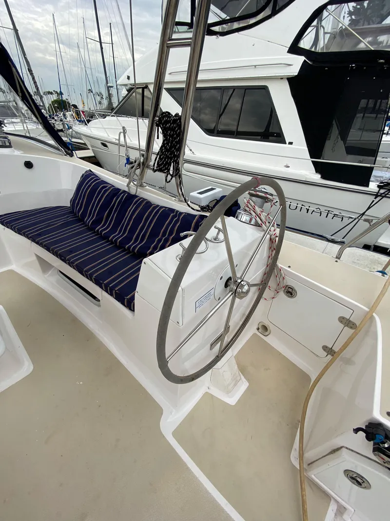 Slide: The Image of 2014 Marlow Hunter 40 sailboat cockpit with steering wheel and striped seating. - 38
