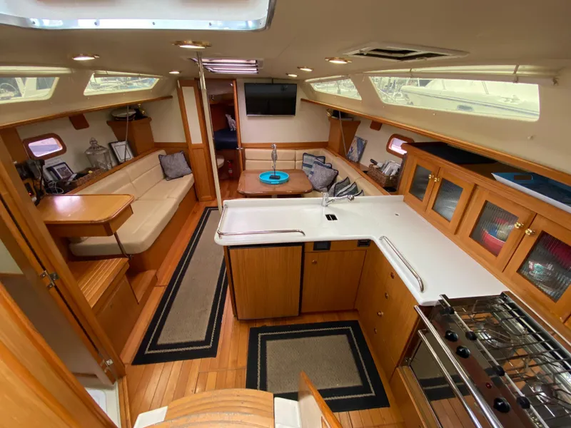 Slide: The Image of Interior of 2014 Marlow Hunter 40 sailboat with modern kitchen and cozy seating area. - 44