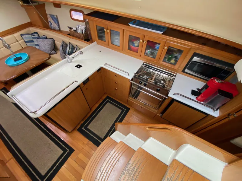 Slide: The Image of Interior of 2014 Marlow Hunter 40 yacht with modern kitchen and dining area. - 45
