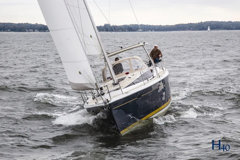 Slide: The Image of 2014 Marlow Hunter 40 sailboat navigating choppy waters. - 7