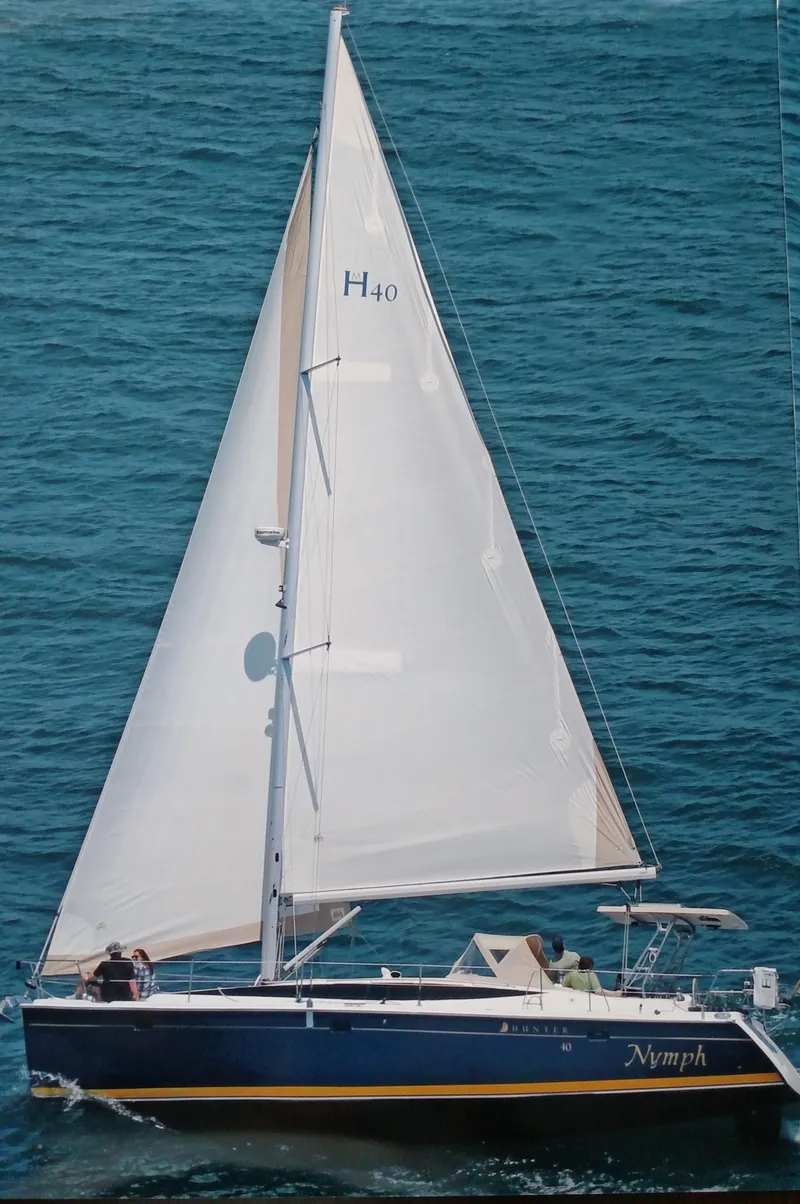 Slide: The Image of 2014 Marlow Hunter 40 sailboat cruising on open water. - 8