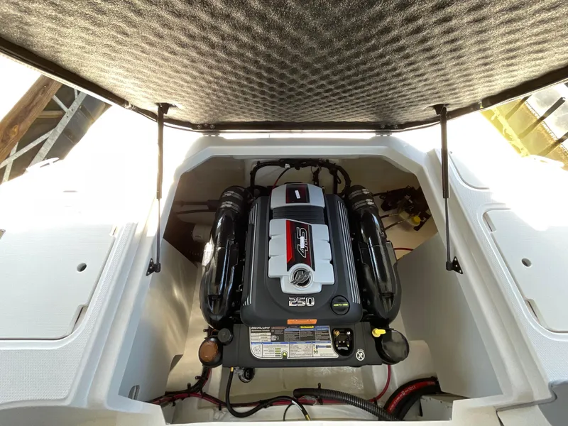 Slide: The Image of 2024 Chaparral 23 SSi boat engine compartment with open hatch. - 10