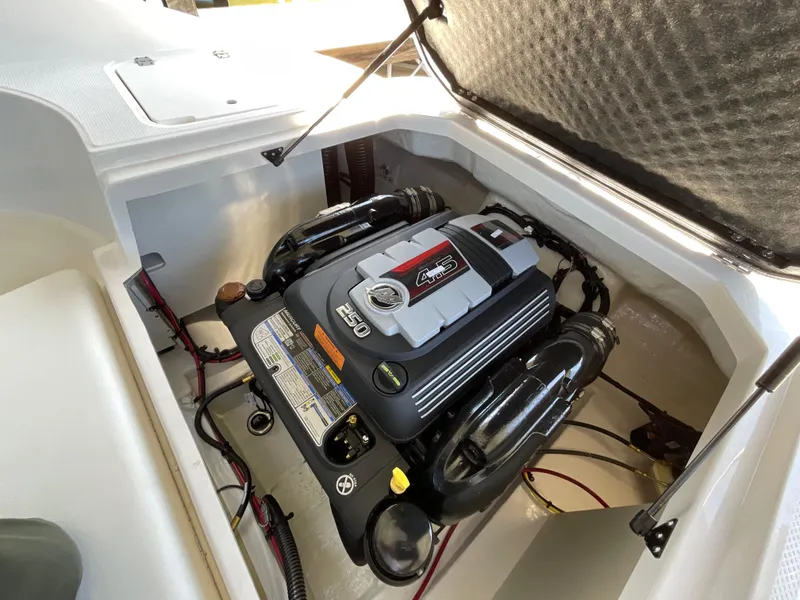 Slide: The Image of 2024 Chaparral 23 SSi boat engine compartment with powerful motor. - 11