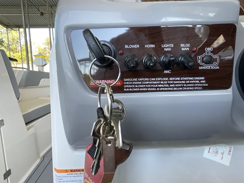 Slide: The Image of Dashboard of 2024 Chaparral 23 SSi boat with ignition keys and control panel. - 15