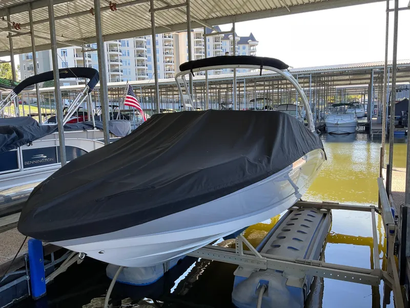 Slide: The Image of 2024 Chaparral 23 SSi boat covered in marina dock. - 16