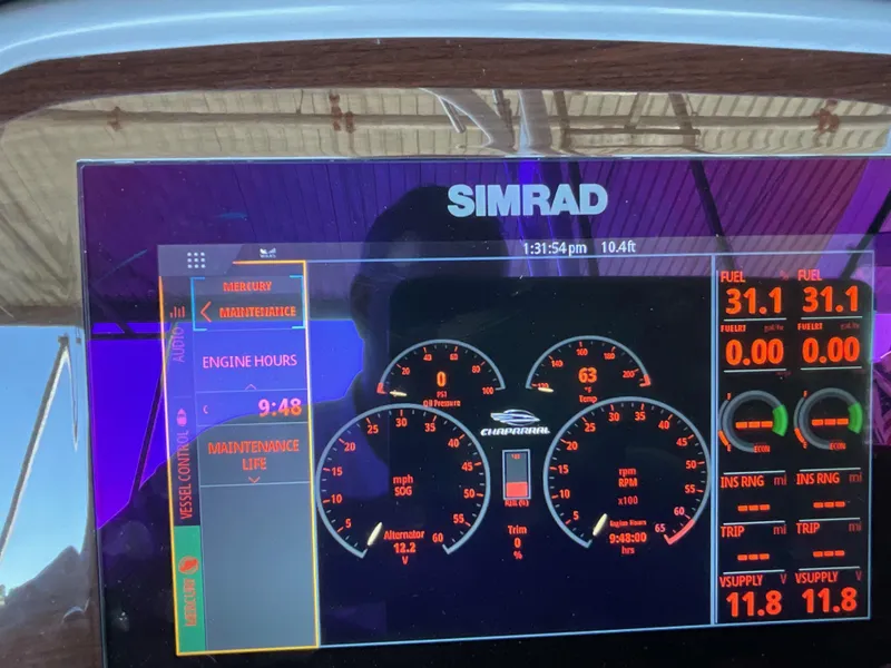 Slide: The Image of Simrad display on 2024 Chaparral 23 SSi showing engine metrics and fuel levels. - 2