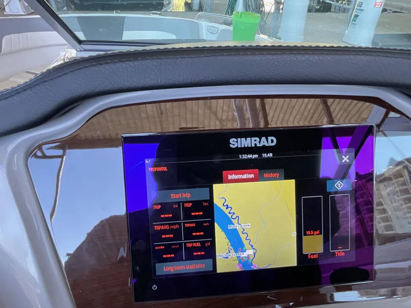 Slide: The Image of Simrad navigation display on 2024 Chaparral 23 SSi boat dashboard. - 9