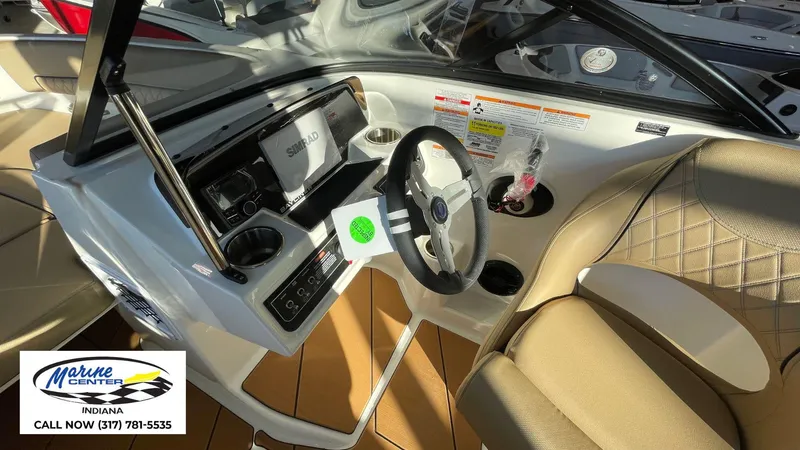 Slide: The Image of Interior of 2025 Bayliner D22I boat with steering wheel and dashboard controls. - 4