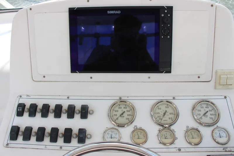 Slide: The Image of Control panel of 2005 Pro-Line 29 Express boat with gauges and switches. - 6
