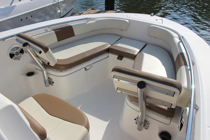 Slide: The Image of 2017 Robalo R200ES boat interior with cushioned seating and sleek design. - 16