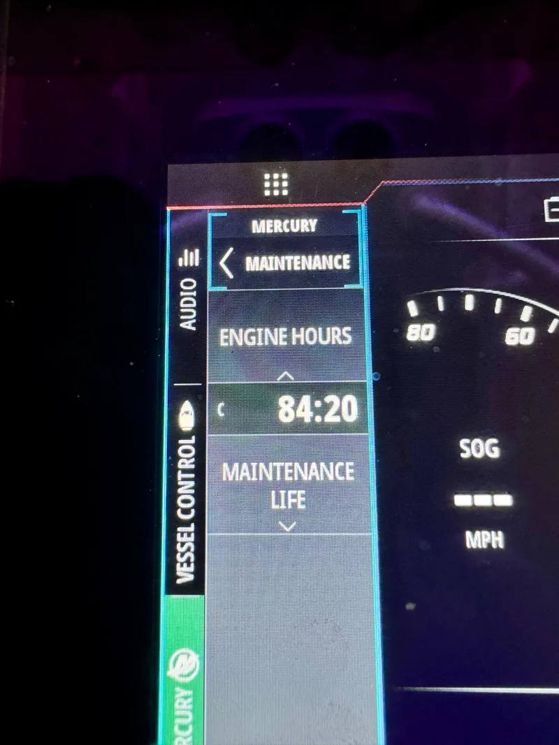 Slide: The Image of 2024 Contender 26 Bay engine display showing 84:20 engine hours. - 22