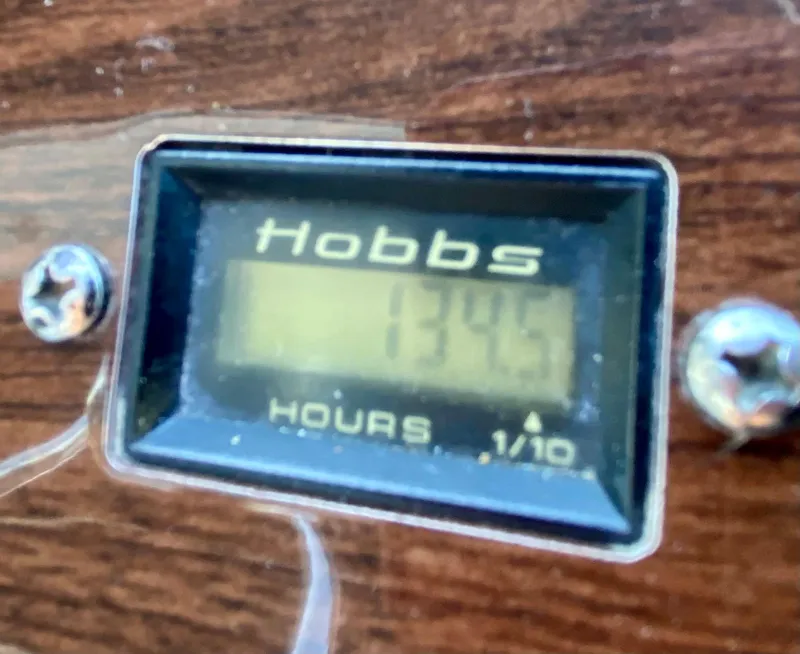 Slide: The Image of Hobbs hour meter showing 1345 hours on Chaparral Signature 350, 2006 model. - 12