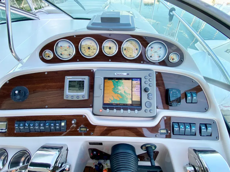 Slide: The Image of 2006 Chaparral Signature 350 dashboard with navigation system and gauges. - 13
