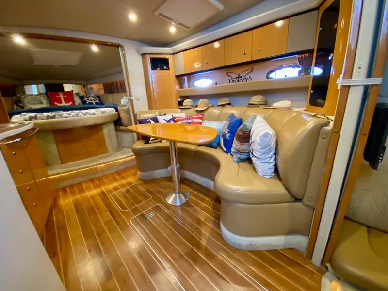 Slide: The Image of Luxurious 2006 Chaparral Signature 350 yacht interior with plush seating and wooden flooring. - 17