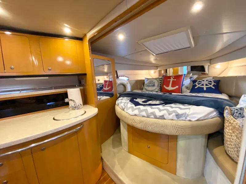 Slide: The Image of Luxurious 2006 Chaparral Signature 350 yacht interior with cozy bed and kitchenette. - 19