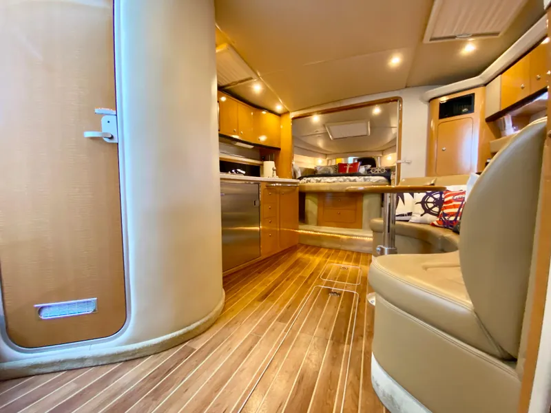 Slide: The Image of Interior of 2006 Chaparral Signature 350 yacht with wood flooring and modern amenities. - 21