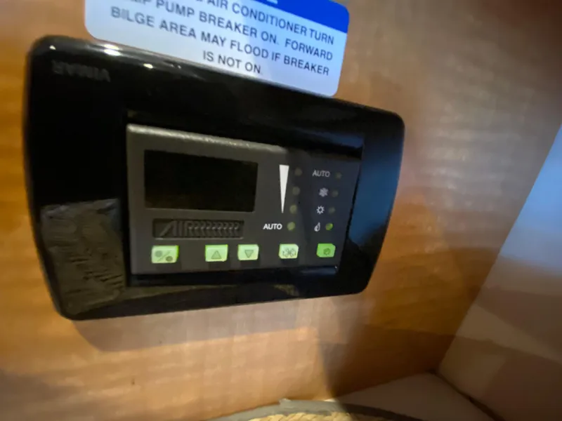 Slide: The Image of Control panel inside 2006 Chaparral Signature 350 boat cabin. - 24