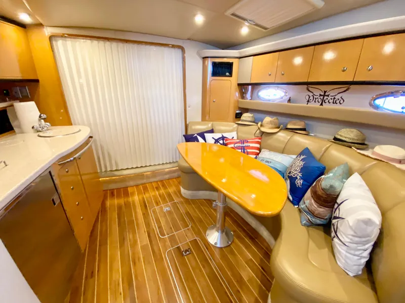 Slide: The Image of Luxurious 2006 Chaparral Signature 350 yacht interior with wood flooring and cozy seating area. - 27