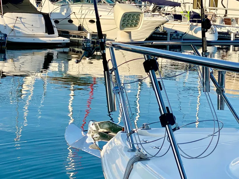 Slide: The Image of Chaparral Signature 350 boat docked in marina, reflecting on calm water, 2006 model. - 33