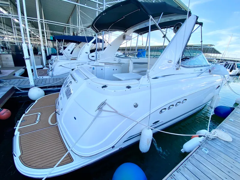 Slide: The Image of 2006 Chaparral Signature 350 yacht docked at marina, featuring sleek white design. - 35