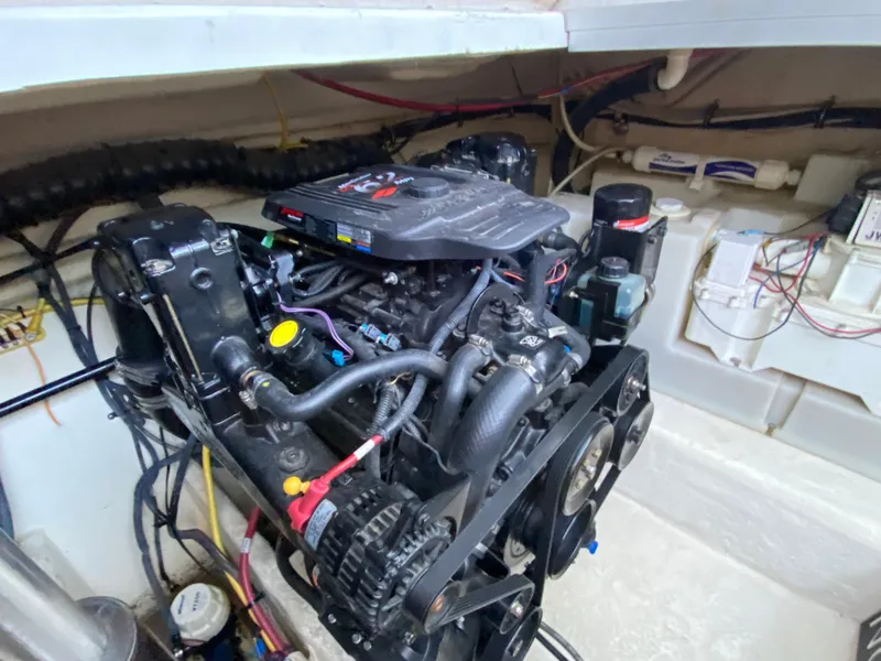 Slide: The Image of Engine compartment of 2006 Chaparral Signature 350 boat, showcasing detailed mechanical components. - 42