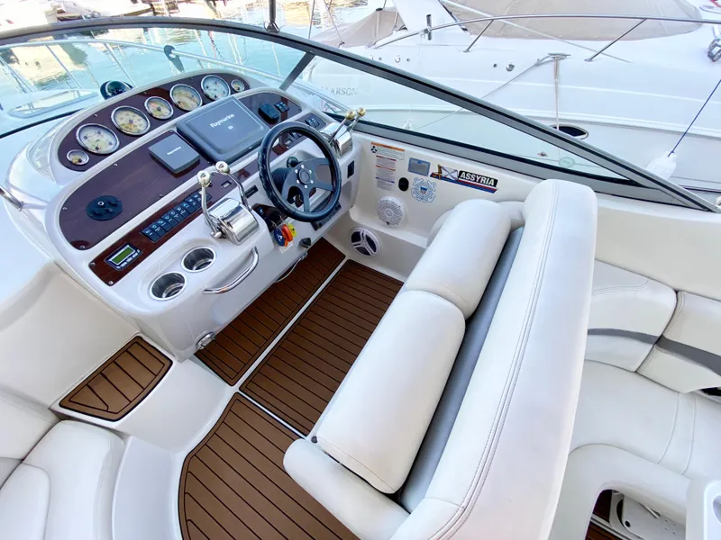 Slide: The Image of 2006 Chaparral Signature 350 boat cockpit with modern controls and wood accents. - 6
