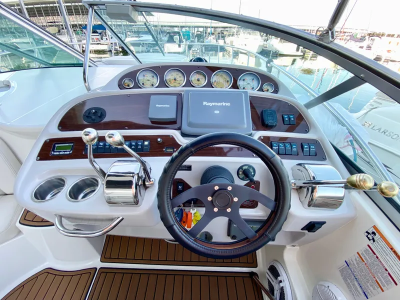Slide: The Image of 2006 Chaparral Signature 350 helm with steering wheel and navigation controls. - 7