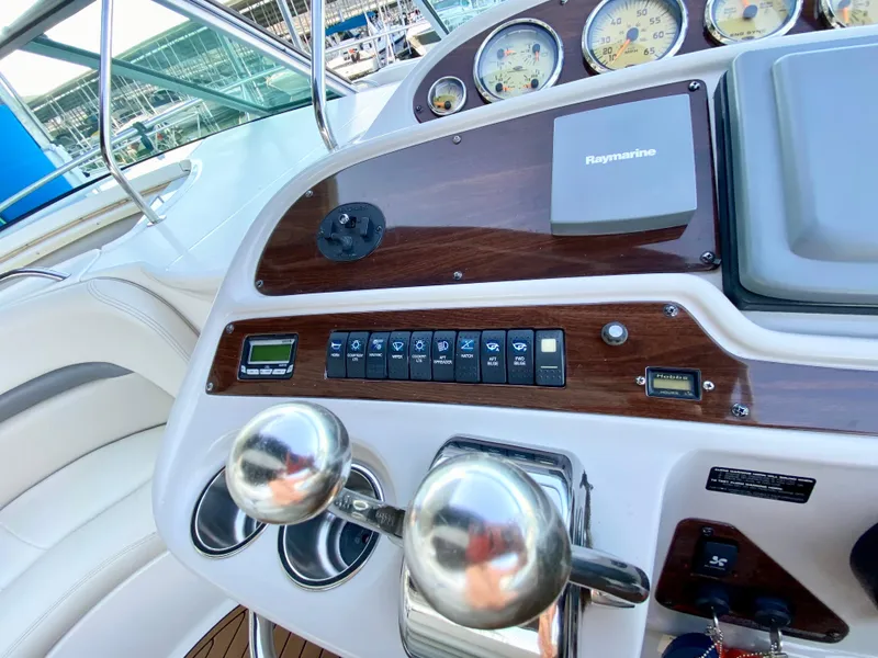 Slide: The Image of Control panel of 2006 Chaparral Signature 350 boat with gauges and navigation equipment. - 9