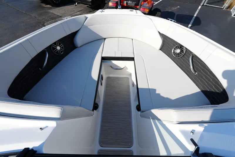 Slide: The Image of 2025 Sea Ray SPX 230 boat interior with white seating and black accents. - 17
