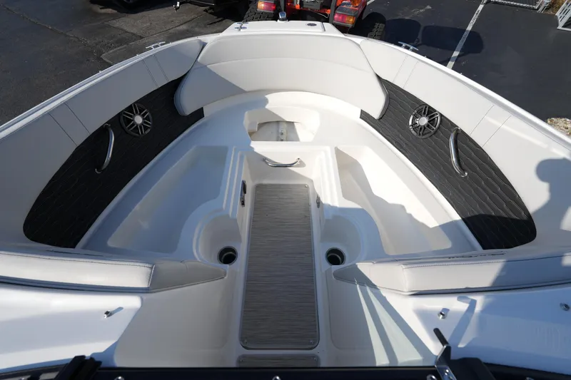 Slide: The Image of 2025 Sea Ray SPX 230 boat interior with white seating and black accents. - 18