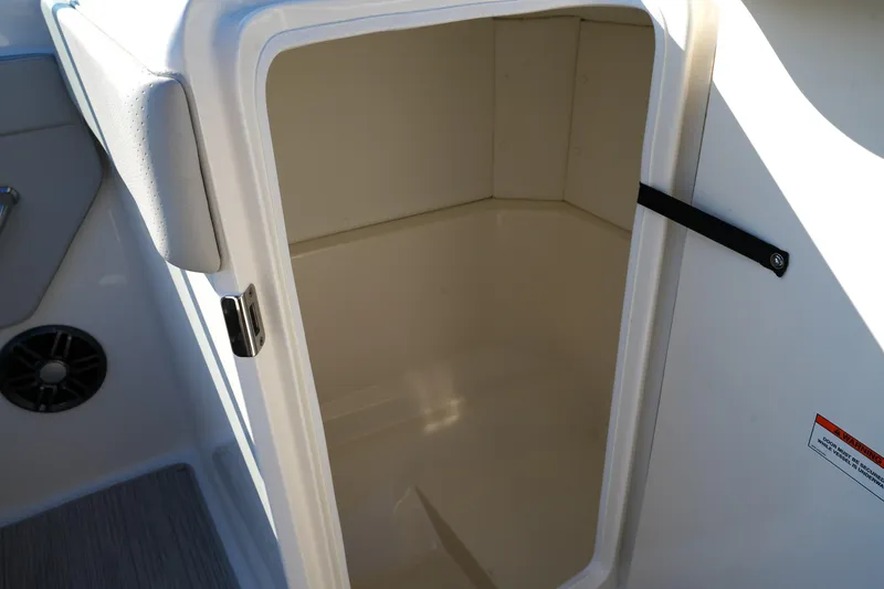 Slide: The Image of 2025 Sea Ray SPX 230 boat storage compartment, open and empty. - 22
