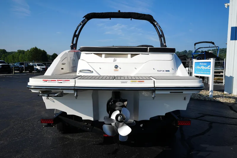 Slide: The Image of 2025 Sea Ray SPX 230 boat rear view with propeller and swim platform. - 6