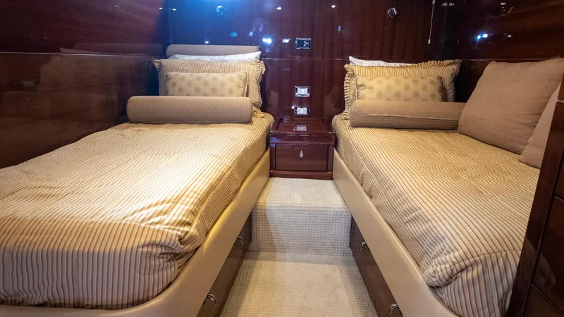 Slide: The Image of Luxurious twin cabin interior of 2008 Savannah 54 yacht with elegant bedding. - 16