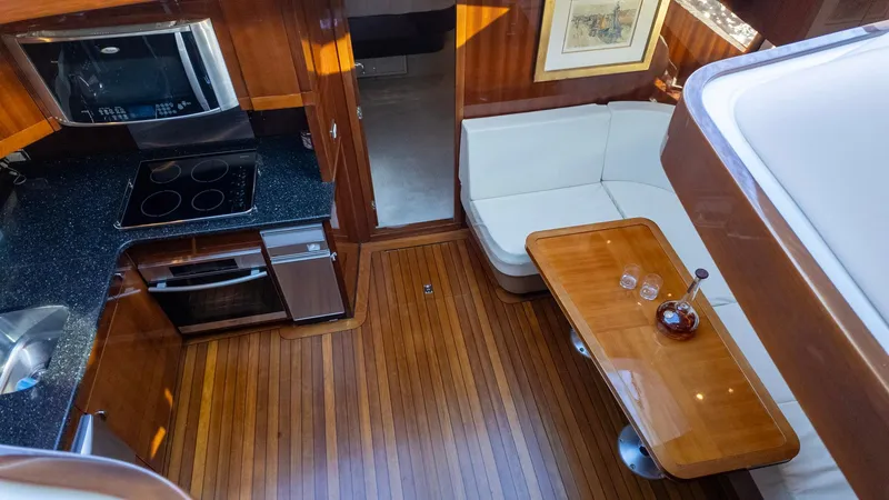 Slide: The Image of Luxurious 2008 Savannah 54 yacht interior with kitchen and dining area. - 17