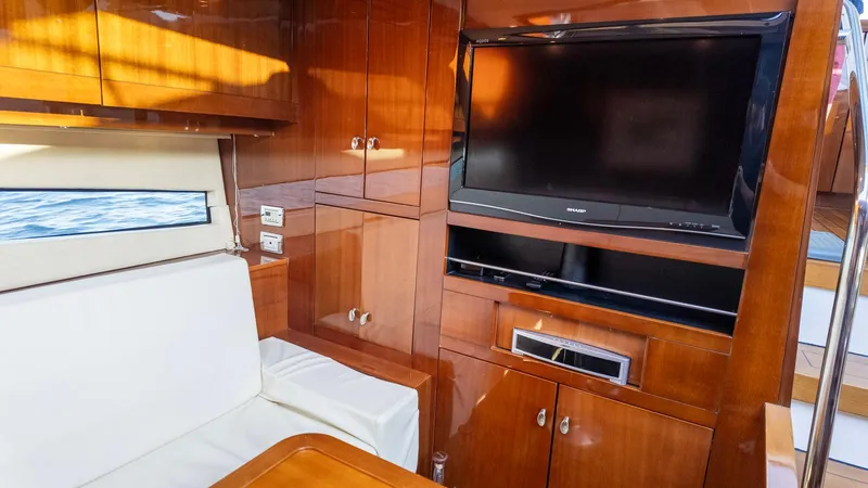 Slide: The Image of Luxurious interior of 2008 Savannah 54 yacht with wood paneling and flat-screen TV. - 22