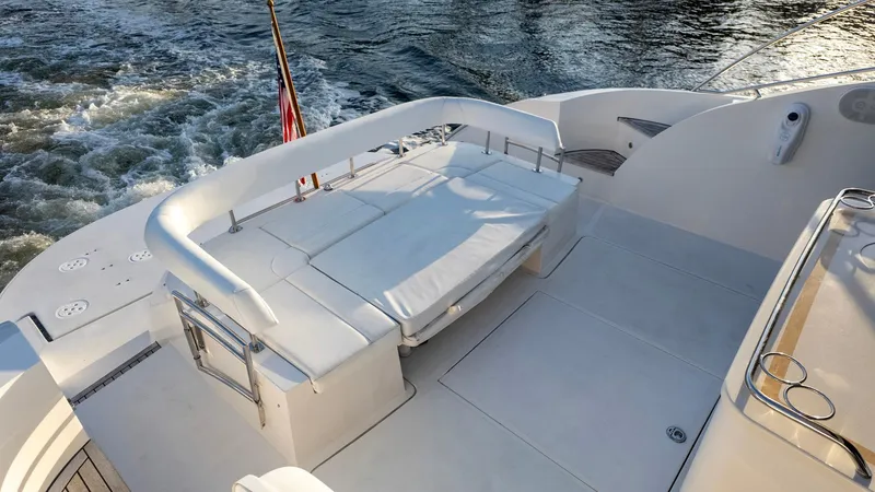 Slide: The Image of Luxurious 2008 Savannah 54 yacht deck with seating, cruising on water. - 32