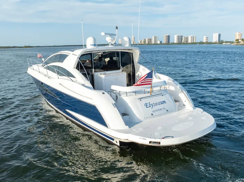 Slide: The Image of Luxury 2008 Savannah 54 yacht cruising near city skyline. - 4