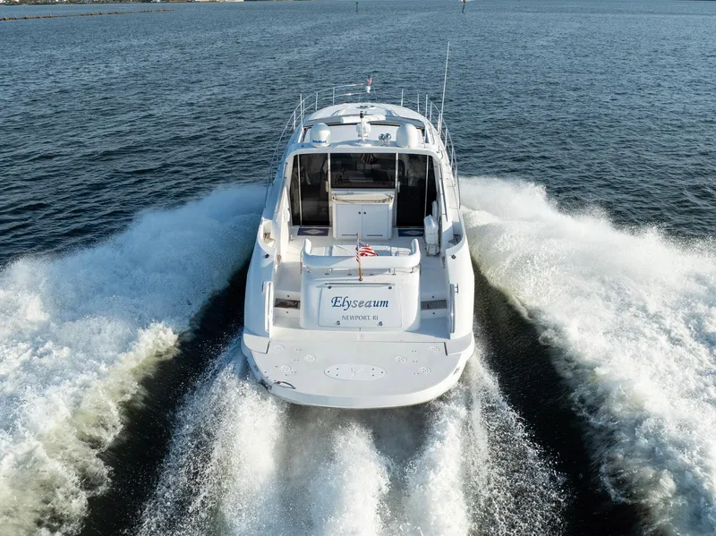 Slide: The Image of 2008 Savannah 54 yacht cruising on open water, rear view. - 5