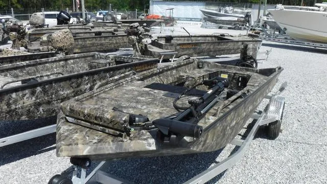 Slide: The Image of 2025 Excel Boats Viper F4 1751 in camouflage, displayed on a trailer in a boatyard. - 10