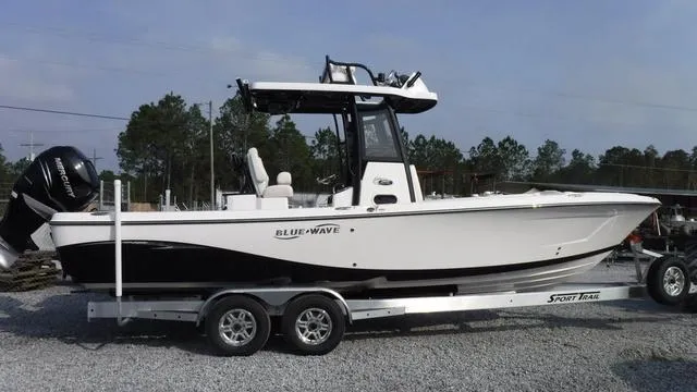 Slide: The Image of 2023 Blue Wave 2800 Makaira boat on trailer, side view. - 1