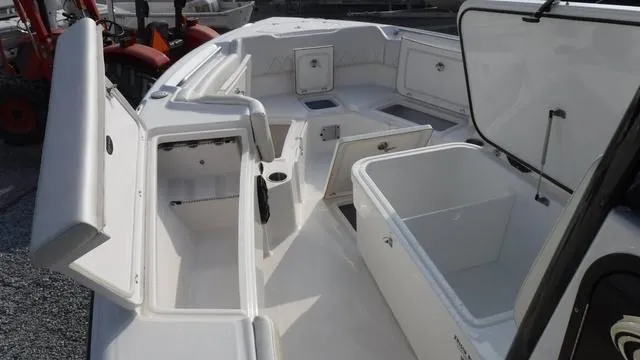 Slide: The Image of 2023 Blue Wave 2800 Makaira boat interior with open storage compartments. - 11