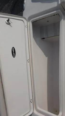 Slide: The Image of 2023 Blue Wave 2800 Makaira boat storage compartment, open and empty. - 15