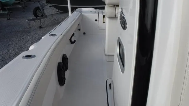 Slide: The Image of 2023 Blue Wave 2800 Makaira boat interior with white seating and sleek design. - 18