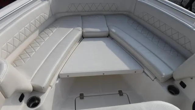 Slide: The Image of 2023 Blue Wave 2800 Makaira boat interior with white cushioned seating. - 21